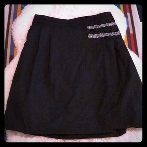 Pleated black skirt with silver detail